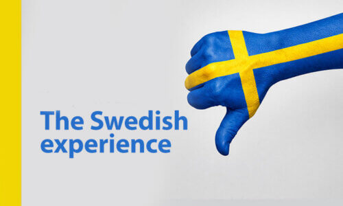 Picture on a hand painted in the Swedish flag, with thumbs down. The picture is about the Swedish experience